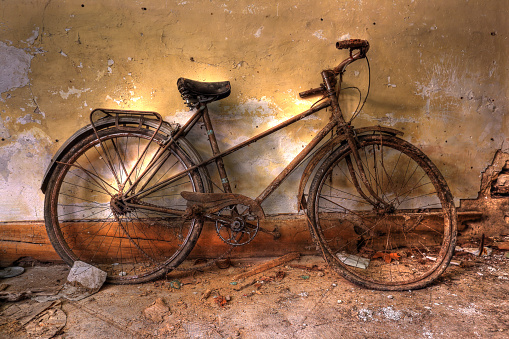 Abandoned bicycle in a discarded house