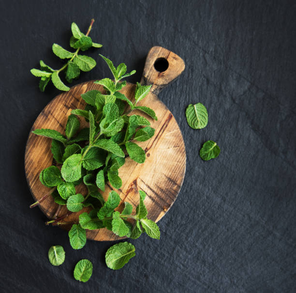 istock Green mint on a old wooden board 960164572