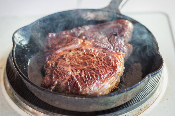 istock Rib eye steak fried on vegetable oil on iron cast 960165056