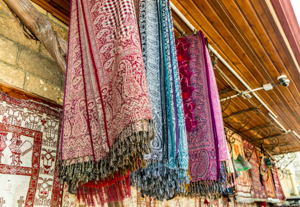 istock Ancient vintage Fabric with ornament hanging outside at bazaar. 960165238