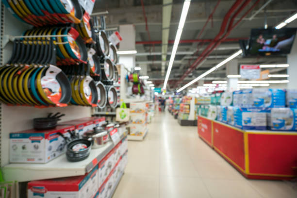 istock Supermarket blurred background with colorful shelves and unrecognizable customers 960165318