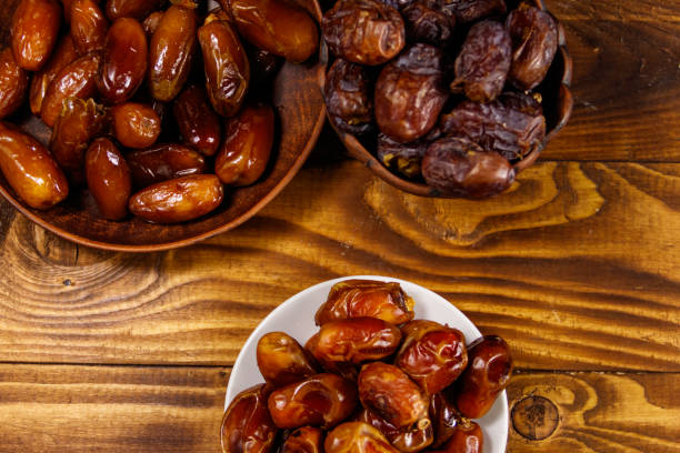 istock Dried dates fruit on wooden table. Top view 960166460