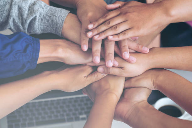 istock Business team standing hands together at office room 960167008