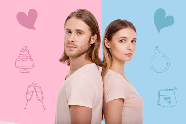 Young couple standing back to back and planning their wedding