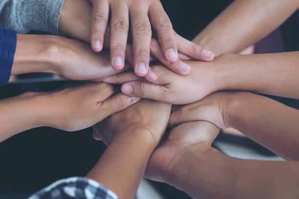 istock Business team standing hands together at office room 960170672