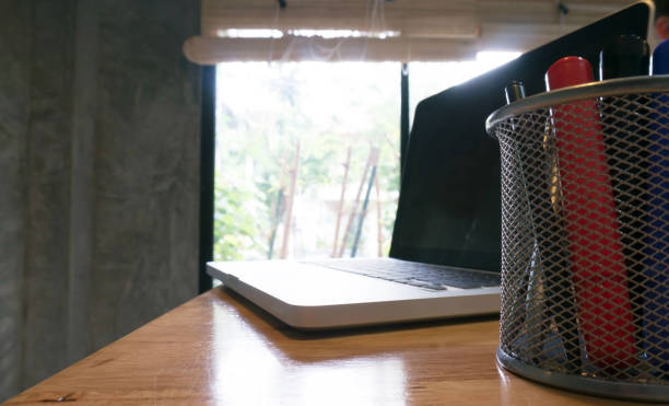 istock Laptop stands on a wooden table 960170988