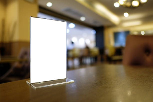 istock Mock up Menu frame standing on wood table in Bar restaurant cafe. space for text 960171260