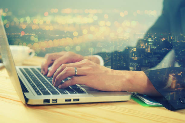 istock double exposure of business man hand using laptop, online banking payment communication network technology,internet wireless application development ,vintage color 960172374