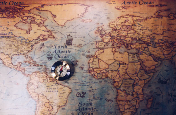 istock Old compass on vintage map. Adventure stories background. Retro style. The map used for background is in Public domain. Map source: Library of Congress. Country: Belgium Year: 1570. Author: Abraham Ortelius (1527-1598) 960177832