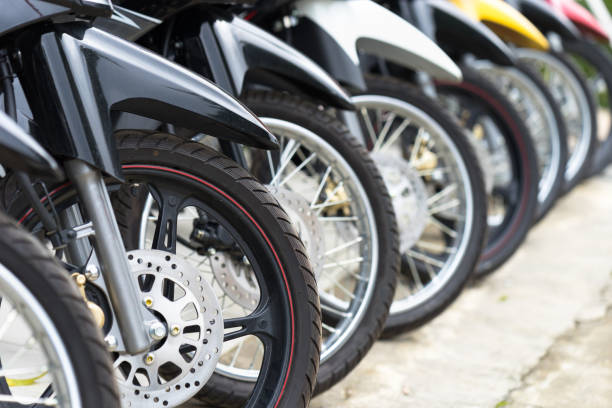 Motorcycles standing in the row at a store, closeup