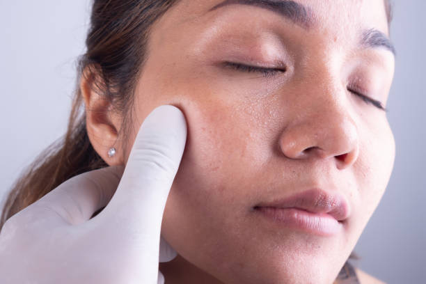 istock asia woman face and doctor's hand 960195638