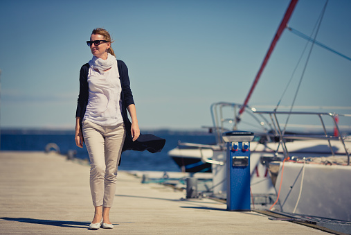 Woman walking in harbor