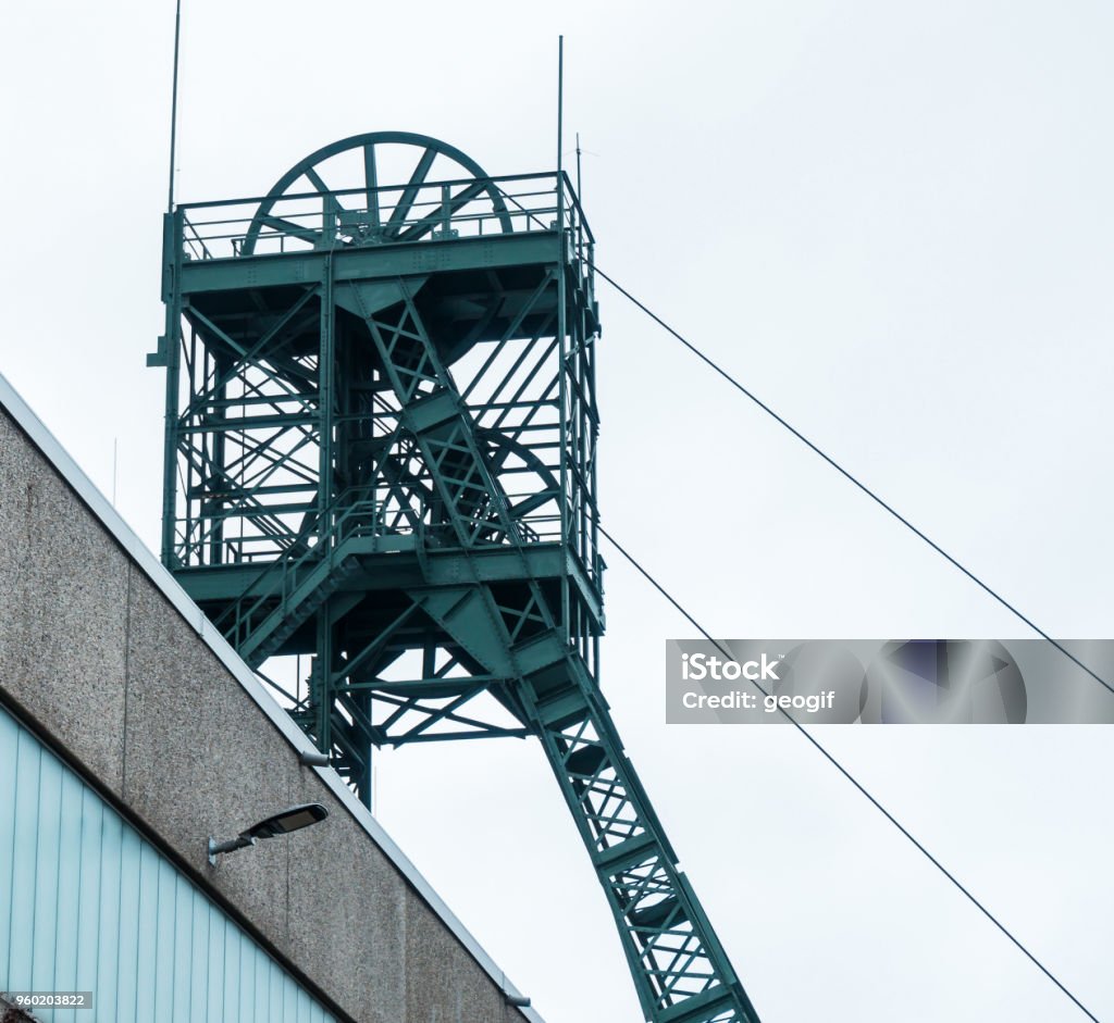Mining tower of the "Asse" mine, a research mine for radioactive waste near Wolfenbuettel in Lower Saxony Germany Mining tower of the "Asse" mine, a research mine for radioactive waste near Wolfenbuettel in Lower Saxony Germany, grey sky Mine Stock Photo
