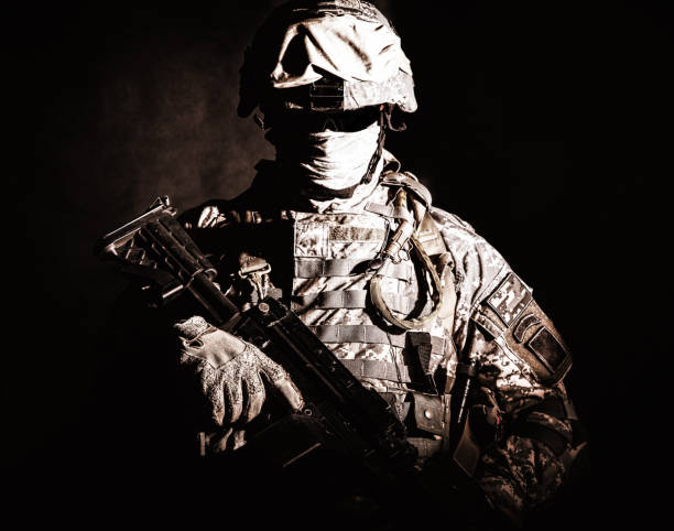 istock US marine infantry with hidden face holding rifle 960204250