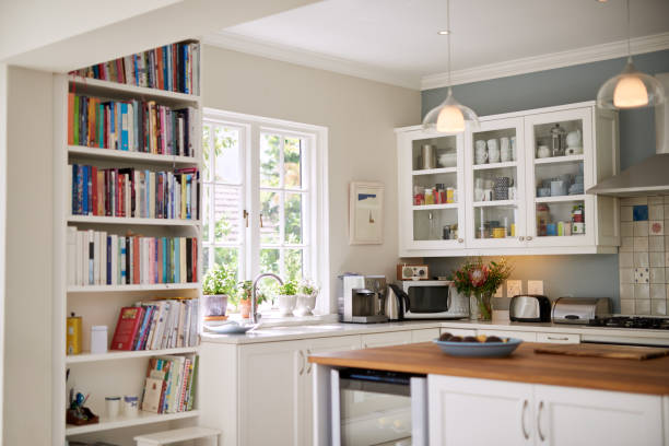 Modern kitchen for modern living Still life shot of the kitchen interior in a residential home neat home stock pictures, royalty-free photos & images