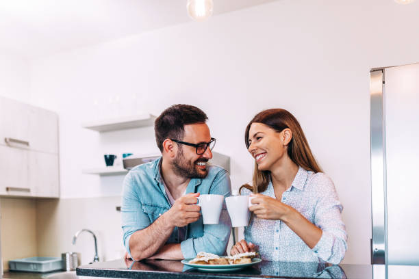 istock Cute couple cheering with cup of coffee or tea. 960209404