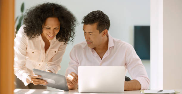 istock Woman showing digital tablet 960212954