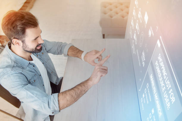 istock Positive designer looking at the screen and measuring the distance 960213090