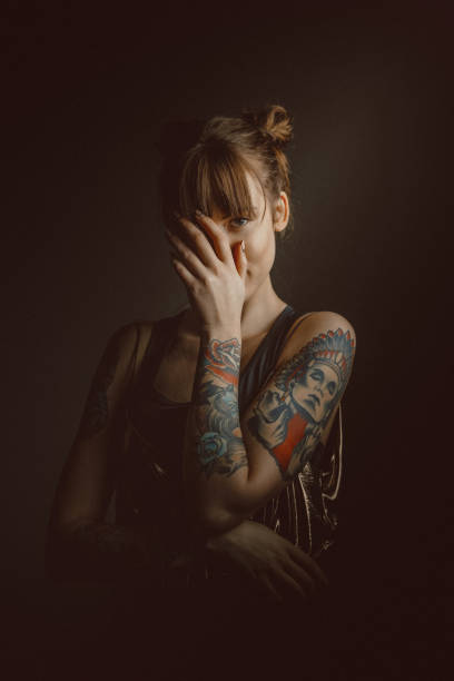 istock Beautiful young woman with tattoos 960217190
