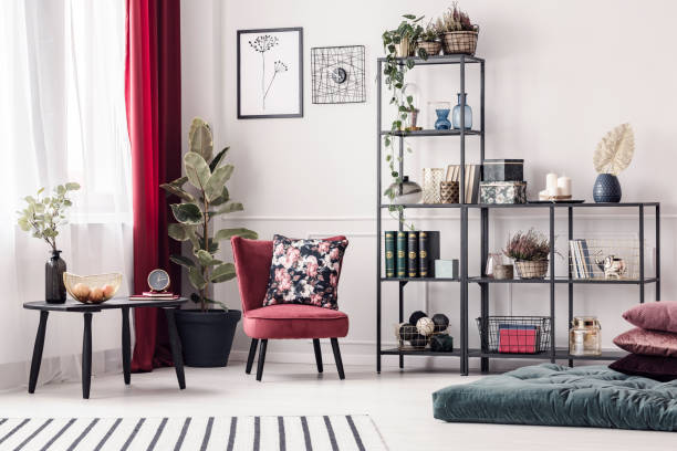 Floral cushion on red armchair