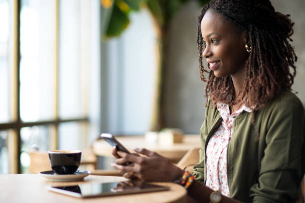 istock African woman using mobile phone. 960217692