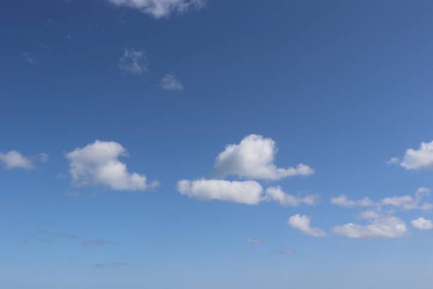 istock Close-up of fluffy white clouds against blue sky 960218464