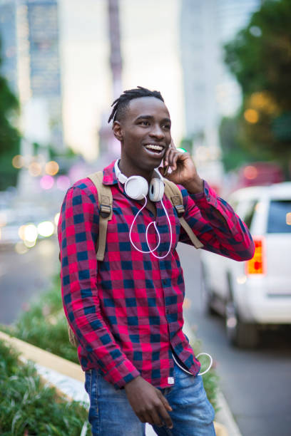 istock Smiling African man talking on the phone. 960218514