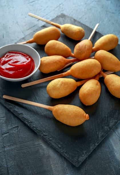 istock Mini Corn Dogs on stone platter with ketchup 960222408