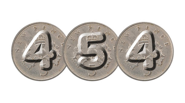 istock 454 written with old British coins on white background 960222748