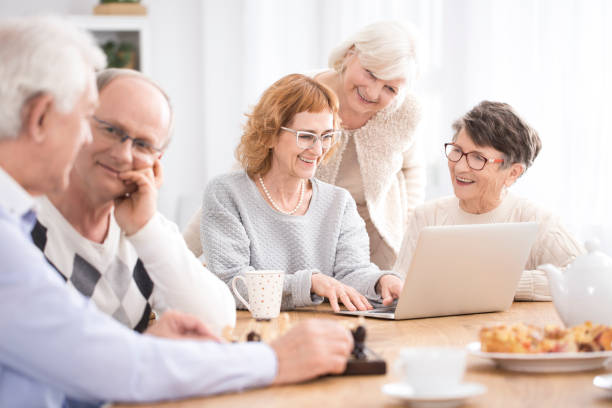 istock Group of seniors sitting at table 960225974