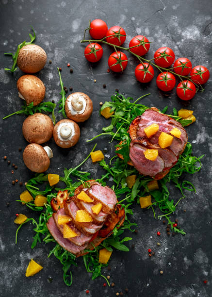 istock Duck breast steak slices on wild rocket pillow sandwich with orange bits, mushrooms and balsamic vinegar drizzle 960226824
