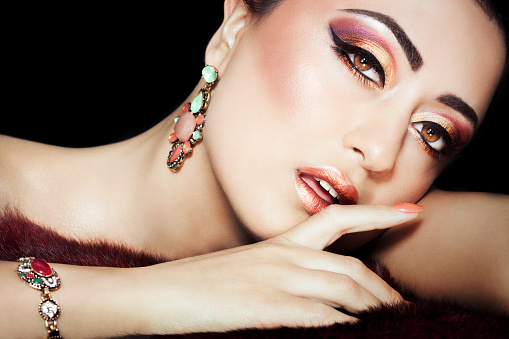 Beautiful exotic woman with exquisite Arabic glitter based makeup.