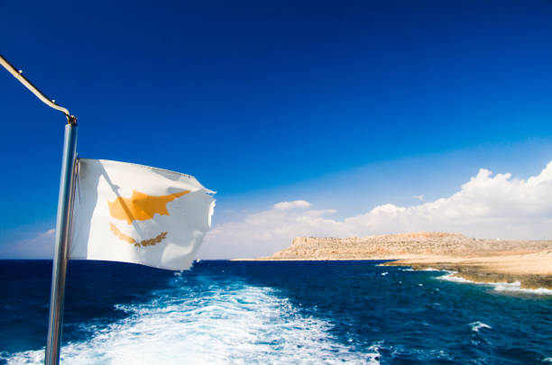 Cyprus Flag is Waving Against Blue Sky in the seaside  on a cruise boat
