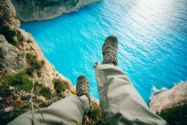 istock traveler sitting on a rock 960230718