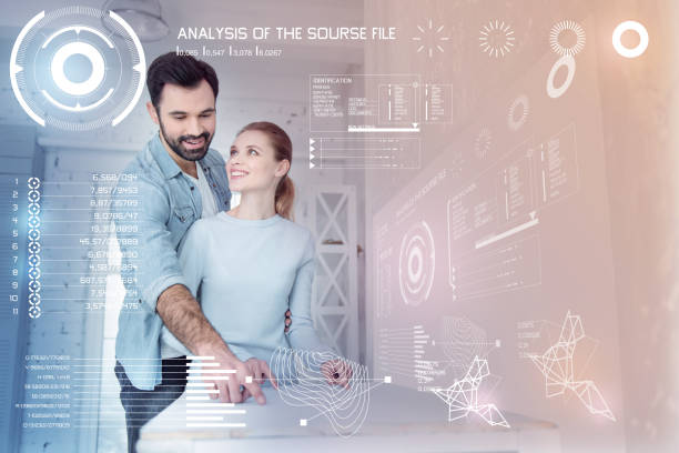 istock Emotional architect smiling while working at home with his wife 960232126
