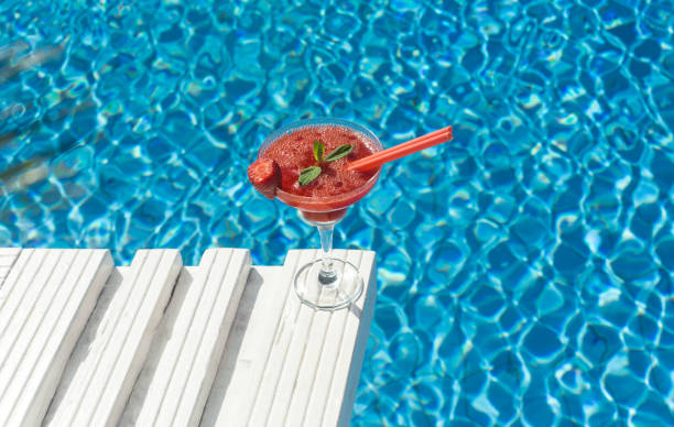 istock Strawberry glasses and pool 960232138