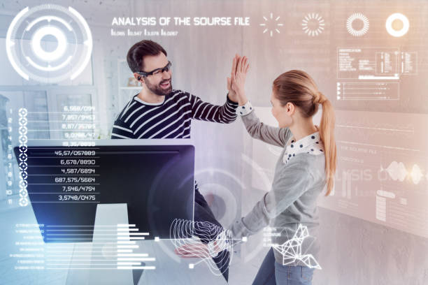 istock Emotional designer smiling while giving five to his coworker 960232804