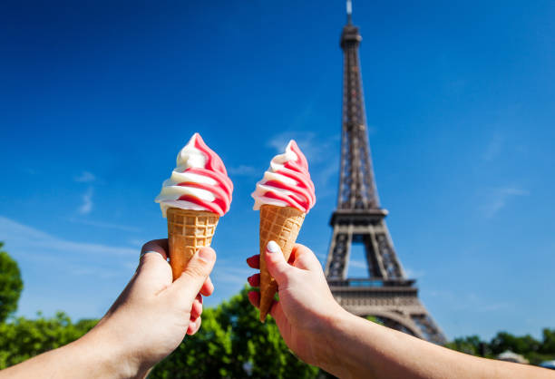 istock Young Couple Eating Ice Cream at Eiffel Tower Paris 960239834