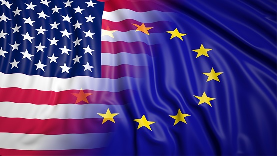 Close-up of American and EU flags