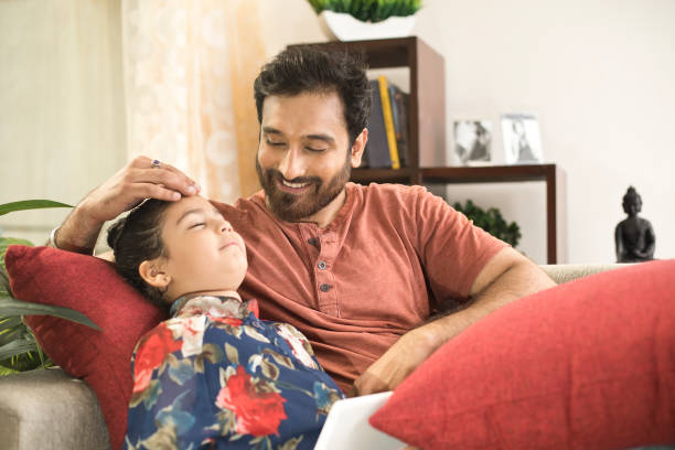 istock Father with daughter sleeping at home 960242340