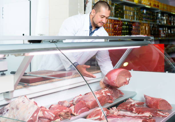 istock Male butcher in fresh meat section 960245428