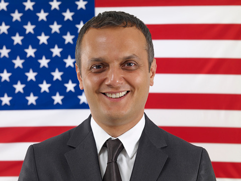 Businessman in front of an American flag