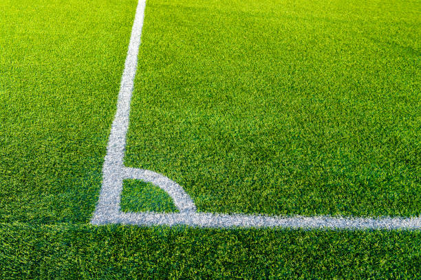 istock white line football corner on green field 960245908