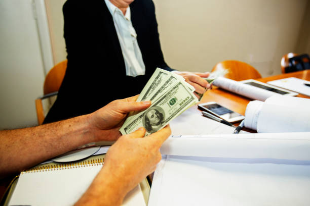 istock Cash is counted during a meeting 960245976