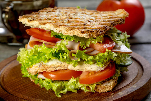 istock Sandwich with ham, cucumber, tomato and lettuce. 960249610