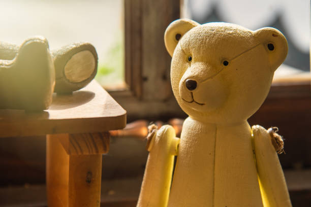 istock Bear Teddy baby toy on wooden background. 960250314