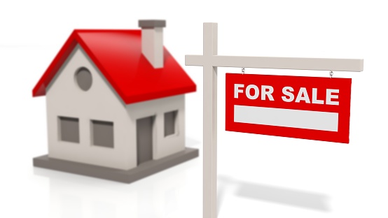 House model with sale sign isolated on white background