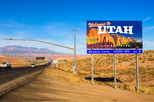 St. George, Utah, USA - December 29, 2017 : Welcome to Utah State Sign situated along Interstate I-15 at the border with Arizona. This billboard reproduces famous landscape of Zion National Park.
