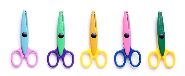 Five colorful pinking scissors for crafting and educating