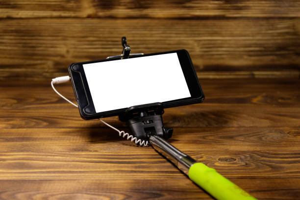 istock Monopod for selfie with smart phone on wood desk 960255350